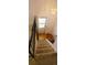 Carpeted staircase leading to an upper level, with black and wood railing at 8389 Benton Way, Arvada, CO 80003