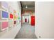 Hallway with color swatches, red doors and a gray, patterned carpet at 2500 Walnut St # 201, Denver, CO 80205