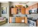 Well-equipped kitchen boasts stainless steel appliances, light wood cabinets, and a stylish backsplash at 2500 Walnut St # 201, Denver, CO 80205