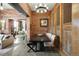 Spacious living room and dining area feature exposed brick, modern furniture, and an open floor plan at 2500 Walnut St # 201, Denver, CO 80205