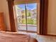 Balcony view from primary suite with sliding glass door that offers a stunning view of the neighborhood at 9238 Viaggio Way, Highlands Ranch, CO 80126