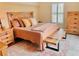 Cozy bedroom featuring warm tones, a plush bed, and wood furniture, creating a relaxing retreat at 9238 Viaggio Way, Highlands Ranch, CO 80126