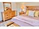 Beautiful primary suite with wood accents, creating a warm and inviting atmosphere for rest and relaxation at 9238 Viaggio Way, Highlands Ranch, CO 80126