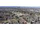 The beautiful aerial view features the neighborhood with school and the city skyline at 110 Forest St, Denver, CO 80220