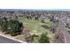 Serene aerial view of a lush green field and neighborhood park in a residential area at 110 Forest St, Denver, CO 80220