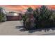 Charming brick ranch-style home with an attached garage and mature landscaping at 110 Forest St, Denver, CO 80220