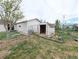 Home backyard with chain-link fence and small shed at 437 S Fetzer St, Byers, CO 80103