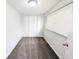 Clean and tidy bedroom featuring fresh carpet, a window with blinds, and closet storage at 437 S Fetzer St, Byers, CO 80103