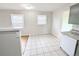 Bright dining area adjacent to the kitchen, featuring large windows and an inviting atmosphere for Gathering meals at 437 S Fetzer St, Byers, CO 80103