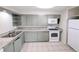 Functional kitchen with ample counter space, updated appliances, and plentiful cabinet storage for cooking needs at 437 S Fetzer St, Byers, CO 80103