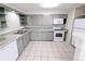 Updated kitchen featuring spacious counters, modern appliances, and ample cabinetry, creating a delightful cooking space at 437 S Fetzer St, Byers, CO 80103
