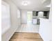 Eat-in kitchen featuring tile flooring, ample counter space, lots of cabinets, and easy access to the backyard at 437 S Fetzer St, Byers, CO 80103