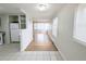 Open layout offering hardwood floors, connecting the living room, kitchen, and dining area for easy entertaining at 437 S Fetzer St, Byers, CO 80103