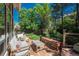 Relaxing back deck with comfortable seating, wooden furnishings, and views of the garden at 5063 E Otero Cir, Centennial, CO 80122