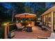 Inviting back deck with a fire pit, comfortable seating, and outdoor grill area at 5063 E Otero Cir, Centennial, CO 80122