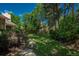 A beautiful backyard with mature landscaping provides a private outdoor retreat at 5063 E Otero Cir, Centennial, CO 80122