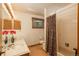 Well-lit bathroom featuring a double sink vanity and a shower with decorative curtain at 5063 E Otero Cir, Centennial, CO 80122