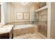 Elegant bathroom with tiled tub, glass-enclosed shower and dual sink vanity at 5063 E Otero Cir, Centennial, CO 80122
