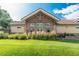 A community building features a stone facade and manicured lawn at 5063 E Otero Cir, Centennial, CO 80122