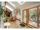 Well-lit dining space with skylights, large windows, and tiled flooring, offering a seamless indoor/outdoor feel at 5063 E Otero Cir, Centennial, CO 80122