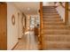 Spacious foyer with tile flooring and staircase leading to the upper level at 5063 E Otero Cir, Centennial, CO 80122