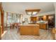 Bright eat-in kitchen with a large bay window and an island that's perfect for preparing meals at 5063 E Otero Cir, Centennial, CO 80122