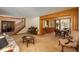 Spacious living area with classic furnishings, adjoining a dining room and staircase at 5063 E Otero Cir, Centennial, CO 80122