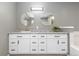 Stylish bathroom featuring double sinks, granite countertops, and a sleek design for a modern touch at 10183 Grove Loop # D, Westminster, CO 80031