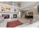 Bright, open-concept living space with fireplace, staircase, dining area, and contemporary decor at 10183 Grove Loop # D, Westminster, CO 80031