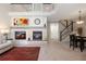 Spacious living room with fireplace, TV inset, stairway, eating area, and high ceilings at 10183 Grove Loop # D, Westminster, CO 80031