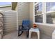 Cozy outdoor patio featuring a rocking chair and small table, ideal for enjoying the outdoors at 10183 Grove Loop # D, Westminster, CO 80031