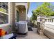 Outdoor patio area featuring a grill, with a view of the front yard and stone exterior at 10183 Grove Loop # D, Westminster, CO 80031