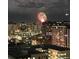 Night-time aerial view of city skyline with fireworks display at 300 W 11Th Ave # 18C, Denver, CO 80204