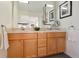 Double vanity bathroom with light wood cabinets at 300 W 11Th Ave # 18C, Denver, CO 80204
