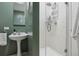 Small bathroom with pedestal sink and shower stall at 300 W 11Th Ave # 18C, Denver, CO 80204