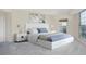 Spacious bedroom with plush bed and large window at 300 W 11Th Ave # 18C, Denver, CO 80204