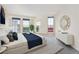 Bright bedroom featuring large windows, a walk-out balcony, and light gray carpet at 300 W 11Th Ave # 18C, Denver, CO 80204