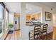 Modern kitchen with breakfast bar and stainless steel appliances at 300 W 11Th Ave # 18C, Denver, CO 80204
