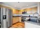 Well-equipped kitchen featuring stainless steel appliances and wood cabinets at 300 W 11Th Ave # 18C, Denver, CO 80204