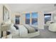 A bright bedroom with plush carpet with a view of the city from several windows, for an airy feel at 300 W 11Th Ave # 18C, Denver, CO 80204