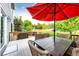 Outdoor deck with dining set and umbrella, perfect for entertaining or relaxation at 12000 Horseshoe Ln, Parker, CO 80138