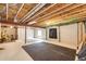 Unfinished basement with exposed beams and concrete walls, ready for customization and storage at 12000 Horseshoe Ln, Parker, CO 80138