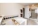 Bathroom featuring a large soaking tub and a separate glass enclosed shower at 12000 Horseshoe Ln, Parker, CO 80138