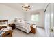 Cozy bedroom showcases a window, a rocking chair, and a wooden chest for comfort and storage at 12000 Horseshoe Ln, Parker, CO 80138
