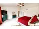 A generously sized bedroom featuring a ceiling fan and a traditional style dresser at 12000 Horseshoe Ln, Parker, CO 80138