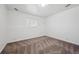 Finished bedroom featuring neutral carpet, window, and simple clean design at 3247 S Newland St, Denver, CO 80227