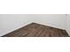 Neutral bedroom with wood-look vinyl flooring and white walls for a clean, modern aesthetic at 3247 S Newland St, Denver, CO 80227