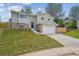 Two-story home with a well-maintained front yard and a two-car garage, perfect for suburban living at 3247 S Newland St, Denver, CO 80227