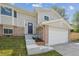 Charming gray two-story home featuring brick accents, fresh landscaping, and a convenient two-car garage at 3247 S Newland St, Denver, CO 80227