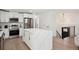 Beautiful kitchen featuring a large center island with marble counters and stainless steel appliances at 3247 S Newland St, Denver, CO 80227